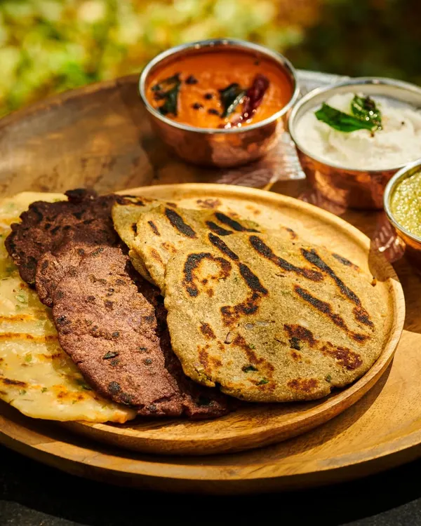 A wholesome and balanced Ayurvedic meal. This platter features Ragi and Rice Roti, served with a variety of chutneys and vegetable preparations, all designed to nourish the body and please the senses.