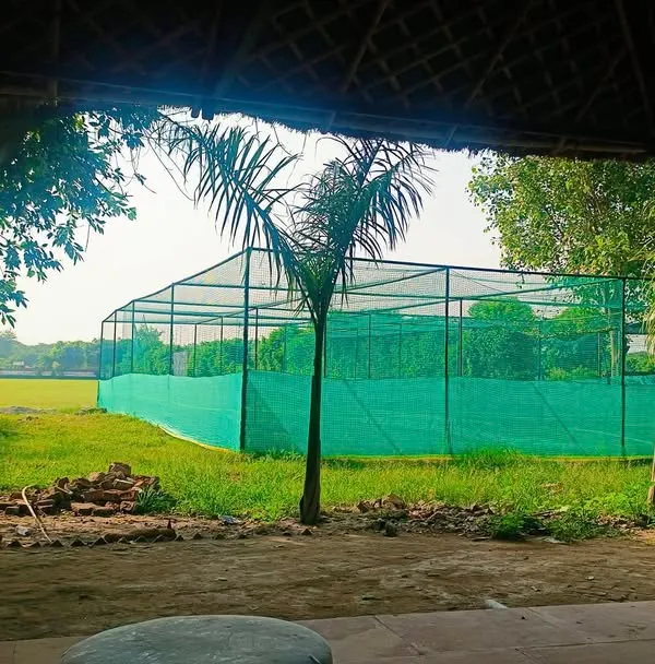 A view of our four practice nets with turf wickets, right next to the main ground. This is where the hard work happens every day.