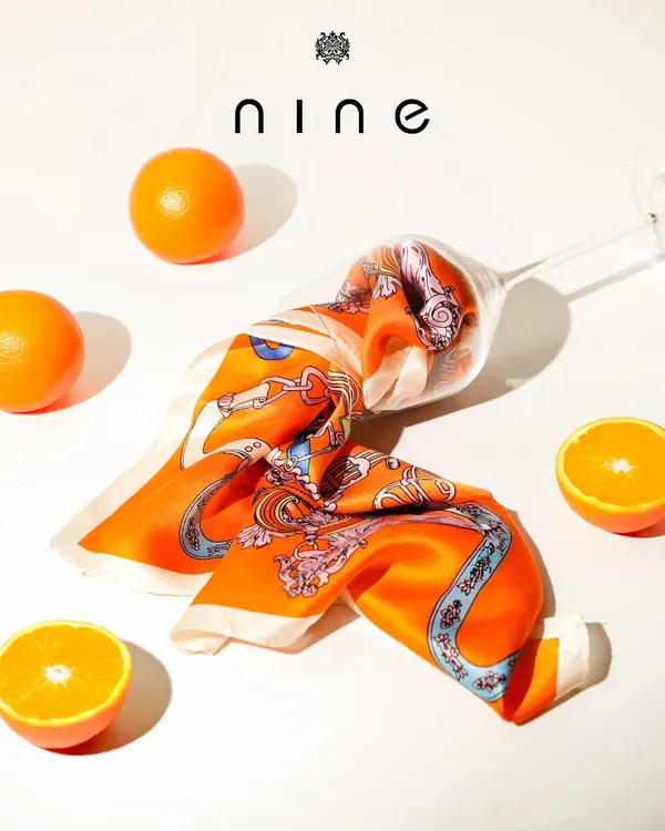 Add a splash of color and personality with our collection of silk pocket squares. This vibrant orange design is perfect for complementing a navy or grey suit.
