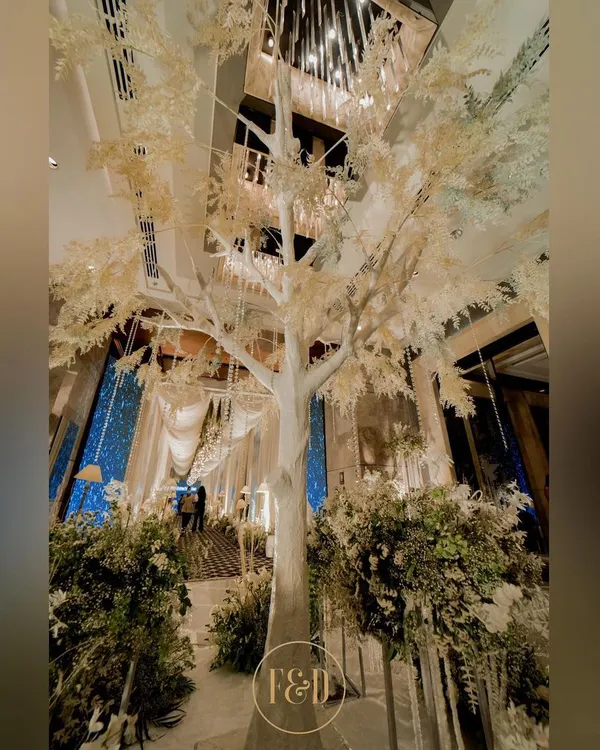 The centerpiece of my 'enchanted winter' theme: a magnificent white tree. This dramatic element transforms an indoor space into a magical, snow-kissed forest.