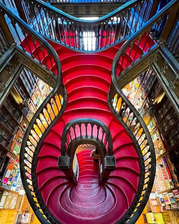 The famous crimson staircase of Livraria Lello in Portugal. This architectural marvel, rumored to have inspired the staircases at Hogwarts, is a breathtaking example of artistry in design. The carved wood, flowing lines, and bold color are incredibly inspiring.