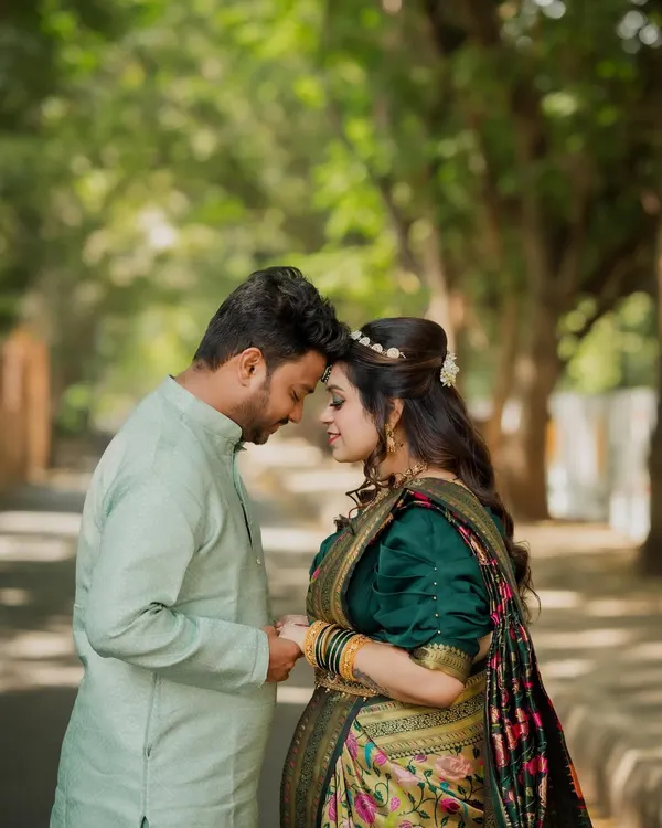 A beautiful, intimate portrait from a cross-cultural engagement shoot. The couple, dressed in elegant traditional wear, shares a quiet moment that speaks volumes of their love.