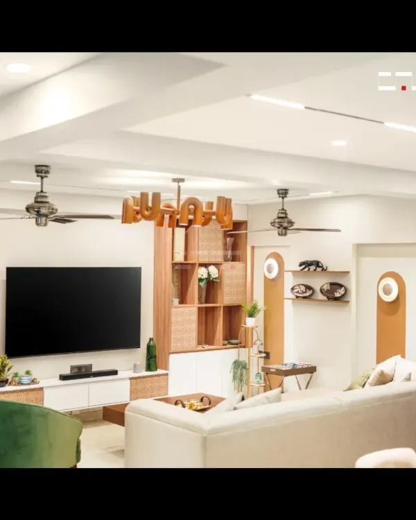 A wider angle of the Jaipur living room, showing the seamless integration of the entertainment unit and shelving. The design prioritizes both aesthetics and smart storage, keeping the space uncluttered and serene.