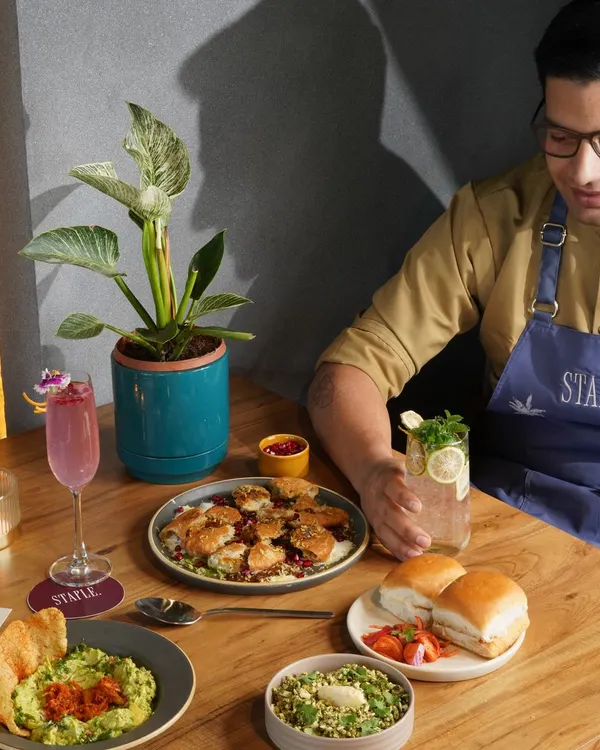 Capturing the chef's passion and the beautiful spread of modern Indian cuisine. This shot for Staple Delhi showcases the variety and artistry of their menu in a single frame.