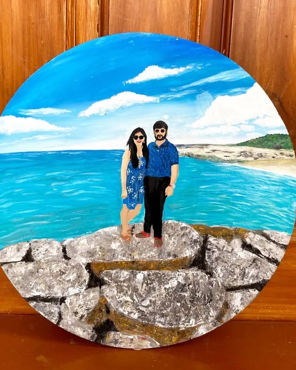 An anniversary gift that tells a story. This custom couple portrait was painted from a photo, capturing a happy memory on a circular canvas that can be displayed for years to come.