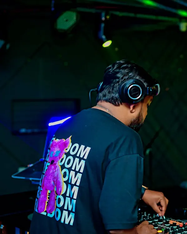A shot from behind while I'm deep in a Bollytech mix. This genre is all about powerful basslines and familiar melodies, creating an irresistible urge to dance.