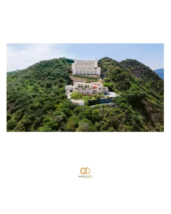 An aerial view of the majestic Alila Bishangarh, a warrior fort turned heritage hotel, standing proudly on a granite hill. This was the incredible stage for Aishwarya and Raghav's destination wedding.