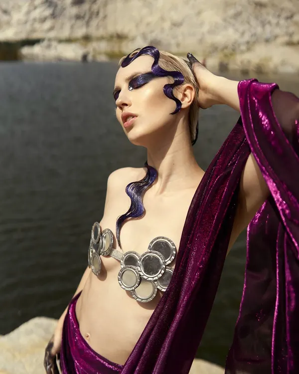 The full 'Siren of the Sea' look. The makeup extends from the face to the hair and hands, paired with a custom mirror bralette to complete the mythical creature concept.