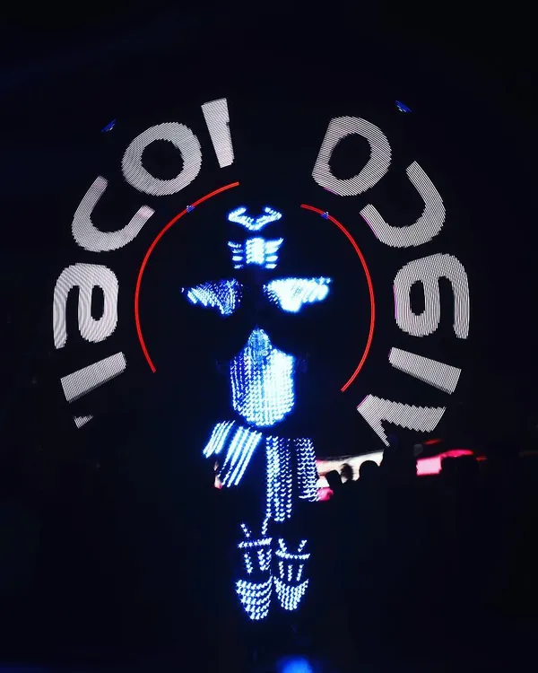 This is one of my signature Predator acts, custom-built for the Viacom18 10th-anniversary event. The entire suit is covered in programmable LEDs, and here you can see the Viacom18 logo displayed clearly on the chest plate while the poi paints light trails around the artist.