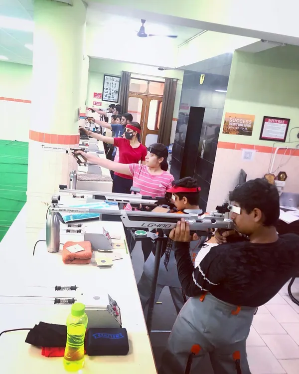 Our range accommodates both pistol and rifle shooters simultaneously. Here you can see a mix of students, young and old, practicing their chosen discipline side by side.