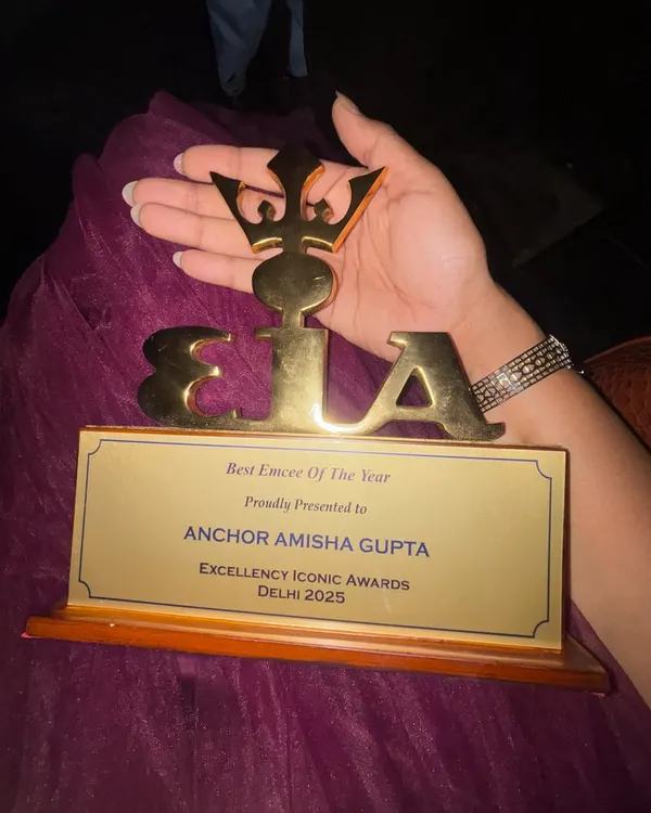 A close-up of the "Best Emcee of the Year" trophy from the Excellency Iconic Awards 2025 in Delhi. This award is a symbol of my dedication to the craft of emceeing.