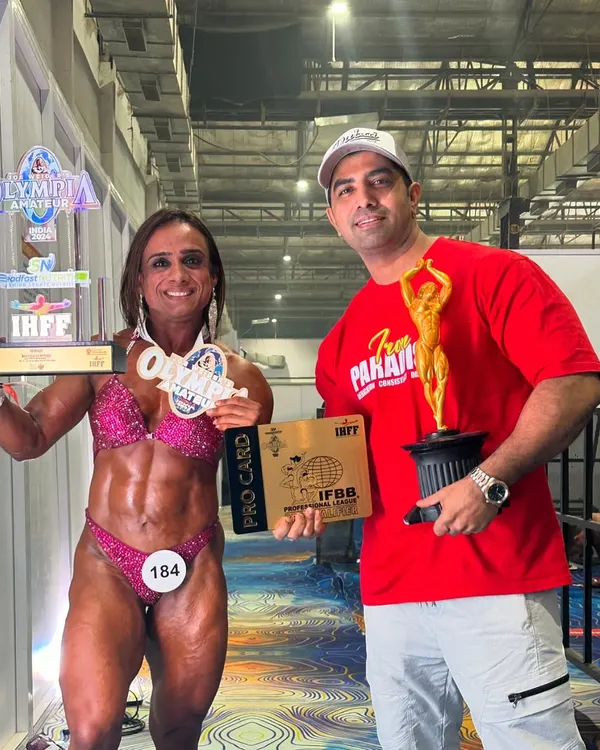 This is what we work for. Here I am with my athlete, Anshul Bhardwaj, right after she won her IFBB Pro Card and the gold medal. Turning dedicated athletes into professional champions is my ultimate goal.
