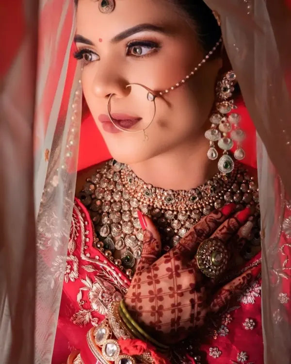 This is the kind of breathtaking look I live to create. Notice how the delicate nath and the layered Polki necklace come together to frame her face, making her look like true royalty. This is what I mean by a 'wow' look.