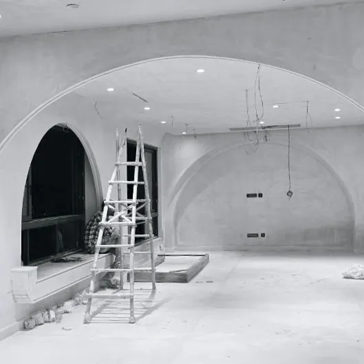 A residential space under construction, where we are introducing a series of arches to shape the room. These classical forms soften the interior and create elegant, flowing transitions between spaces.