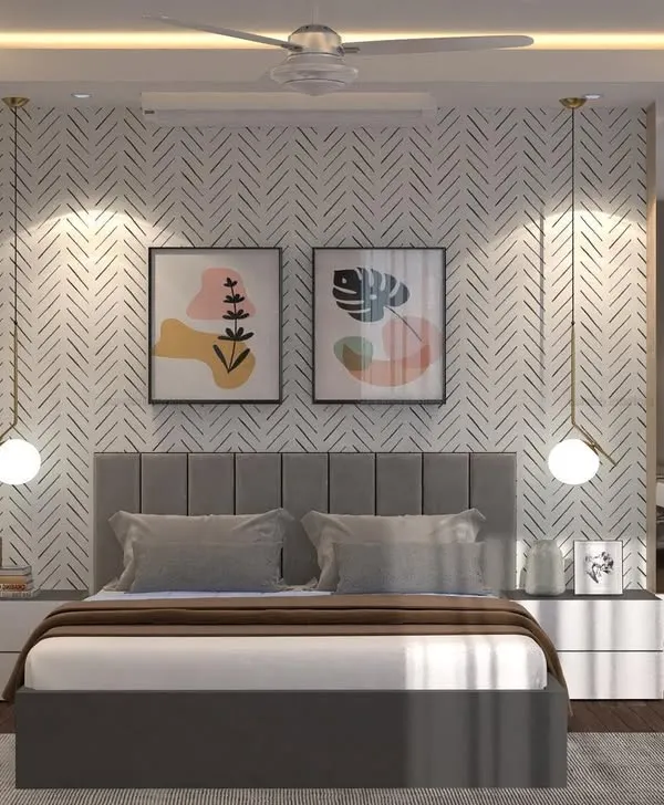 A 3D design concept for a master bedroom in Thane. The room balances textures with a herringbone pattern wall, a soft upholstered headboard, and smooth white bedside tables, all brought together by warm, hanging pendant lights.