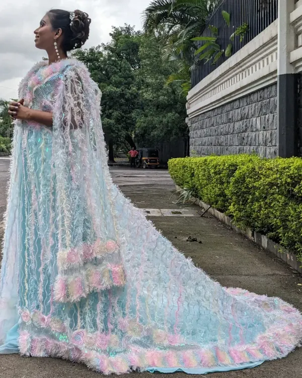 This unique unicorn jacket gown is a true statement piece. The iridescent, feathery cape is detachable, and it's available in a mother-daughter combo.