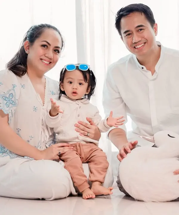 A beautiful family portrait against a clean, white backdrop. This minimalist style is bright and modern, ensuring that the focus remains entirely on your family's happy expressions.