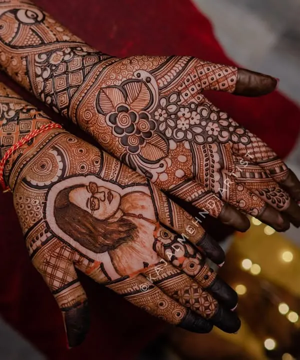 Honoring a sister's love and memory. This custom mehndi for a bride features a heartfelt tribute portrait of her late sister, keeping her loving presence close.