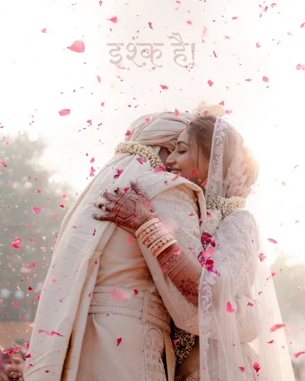 This is it. The moment that feels like everything. A quiet hug, a shower of petals, and the word 'Ishq' hanging in the air. I live for capturing this pure, unscripted love.