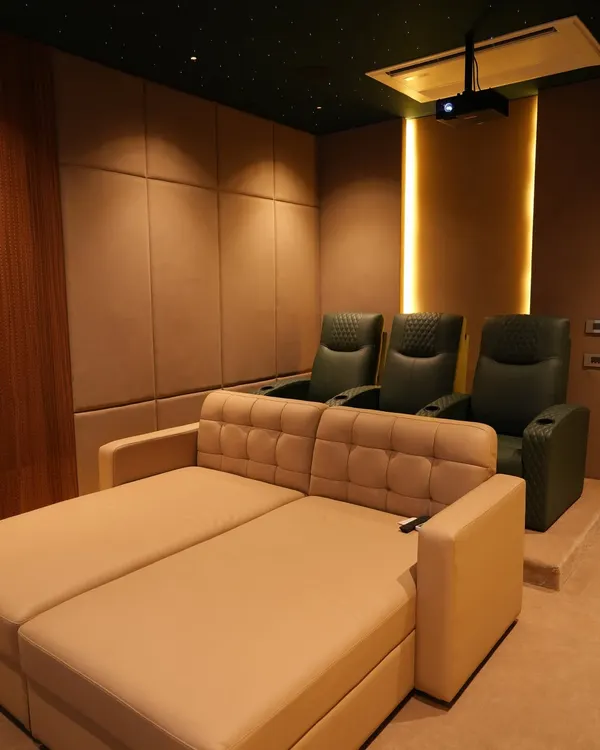 A recent project in Nellore featuring a convertible sofa bed in the front, perfect for casual viewing, with traditional cinema recliners in the back row.