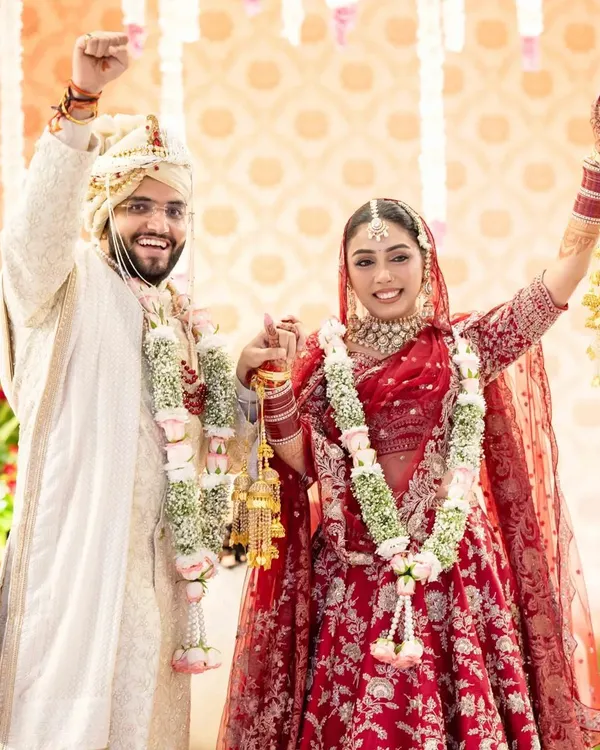 The moment of pure triumph and joy after the varmala ceremony. I love capturing the energy as the couple celebrates becoming husband and wife.