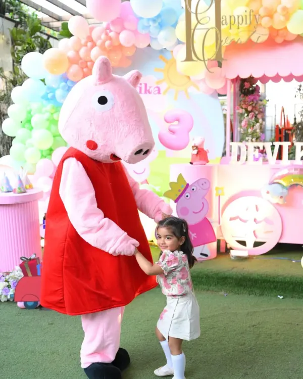 The highlight of any themed party is a visit from the main character. Here, the birthday girl shares a special moment with our Peppa Pig mascot, creating a memory she will cherish forever.