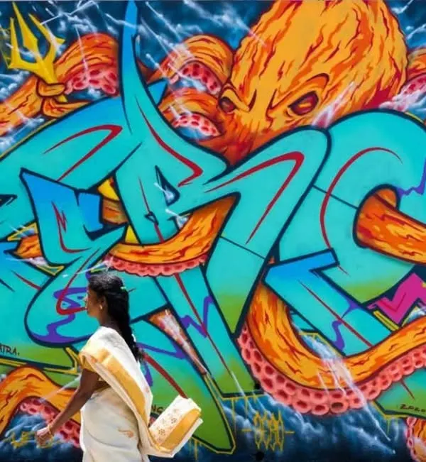 A large-scale mural in Nepal for the MⒺTA-मोRPH-OSIS project, blending my wildstyle lettering with a fierce octopus character. This piece shows how I can transform a public wall into a dynamic work of art that interacts with its surroundings, like this woman in her sari walking by.
