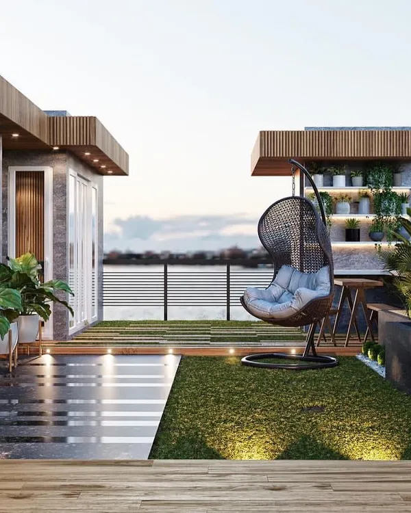 A spacious terrace garden design with a stunning view. The layout includes a mix of artificial grass and dark tiles, a hanging swing chair, and a vertical garden wall.