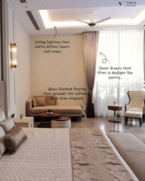 Every detail in this bedroom speaks of calm luxury. We used layered ceiling lighting, sheer drapes to filter daylight, and gloss finished flooring to create a harmonious and elegant space.