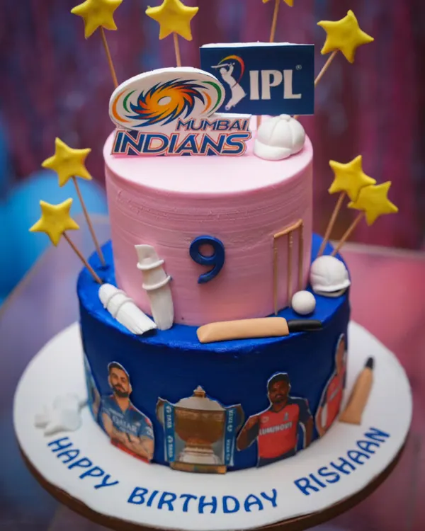 A fantastic two-tiered cricket-themed cake for a true fan. The details, from the wickets to the team logos, are all carefully crafted.