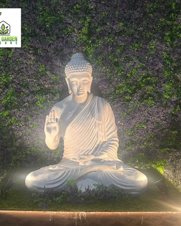 Add a positive and charming vibe to your space by integrating a Lord Buddha statue into your green wall. Here, I used uplighting to make the statue a serene focal point against a purple foliage backdrop.