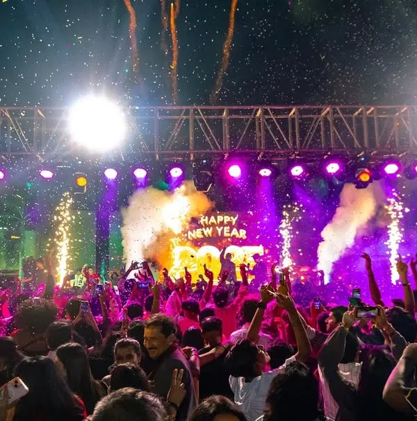 Ringing in the New Year with a bang. This shot captures the peak moment with pyros, smoke, and a sea of phones lighting up the sky. This is the high-octane production I deliver for major events.