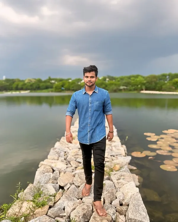 Walking along the stone causeway at this serene lake in Bengaluru. It's a perfect spot for a weekend evening.