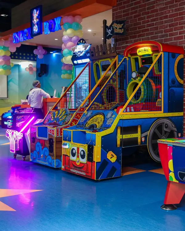 A glimpse of our vibrant arcade area, featuring a variety of games to challenge kids and adults alike. The bright lights and sounds create an exciting atmosphere.
