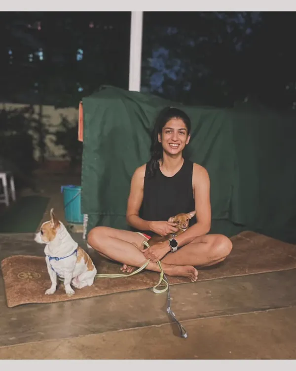 Just a girl and her dogs, sitting on a yoga mat. My pets are a huge part of my life and often join my practice. Come join my classes for some movement and good vibes.