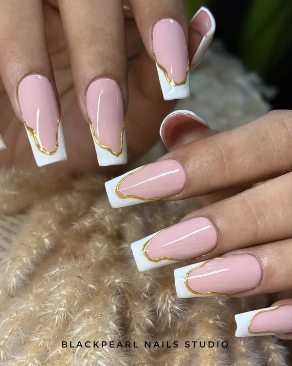 This is a futuristic take on the French manicure, featuring long, square-shaped nails with a crisp white tip. I added a flowing, abstract gold chrome line to separate the pink base from the white tip for a bold and edgy look.