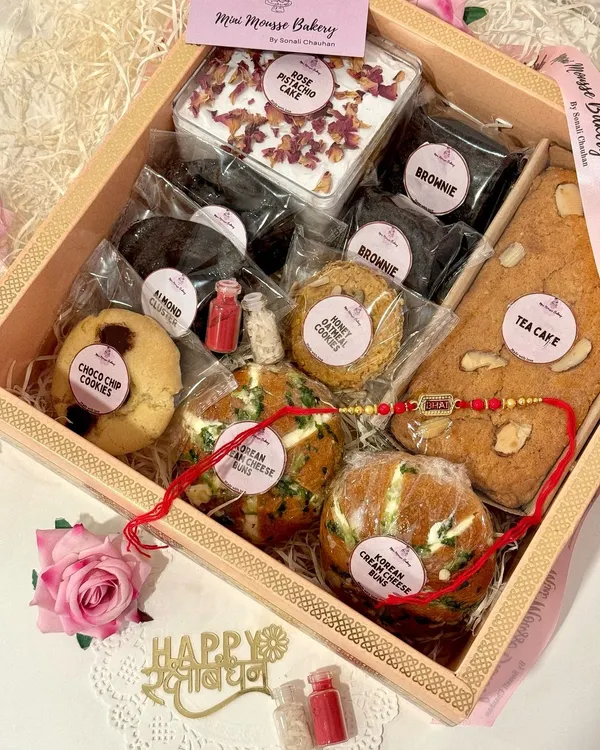 This is what a box full of happiness looks like. My Rakhi hampers are packed with a mix of my bestsellers, from soft Korean cream cheese buns and fudgy brownies to a whole tea cake and assorted cookies. It's the perfect way to show your siblings some love.