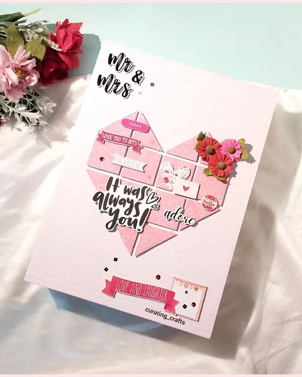 A heart-shaped mosaic of memories. This A4 anniversary scrapbook cover is pieced together with love, featuring 3D flowers and romantic messages, perfect for celebrating your journey together.
