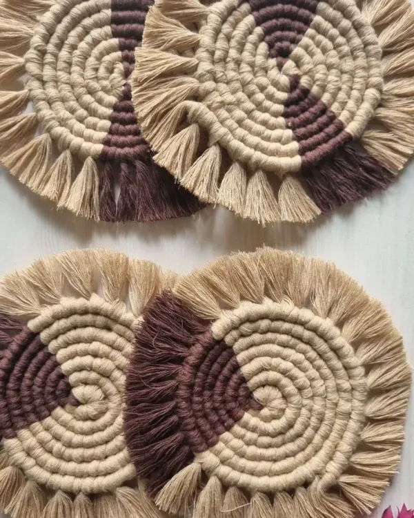 A set of my two-toned spiral coasters in earthy brown and beige. They are made from absorbent cotton, perfect for protecting your furniture.