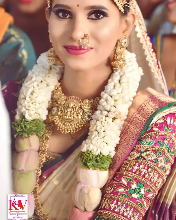 A beautiful, happy bride on her wedding day. I created this smooth, natural makeup look to enhance her features without feeling heavy, perfectly matching her traditional saree and temple jewellery.