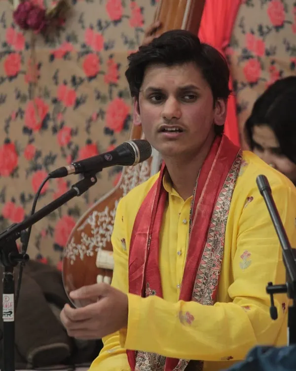 A young student performing with complete focus during the 'Raghunathanjali' Swarveni Baithak. Providing a stage for students to present their art is a cornerstone of our academy.