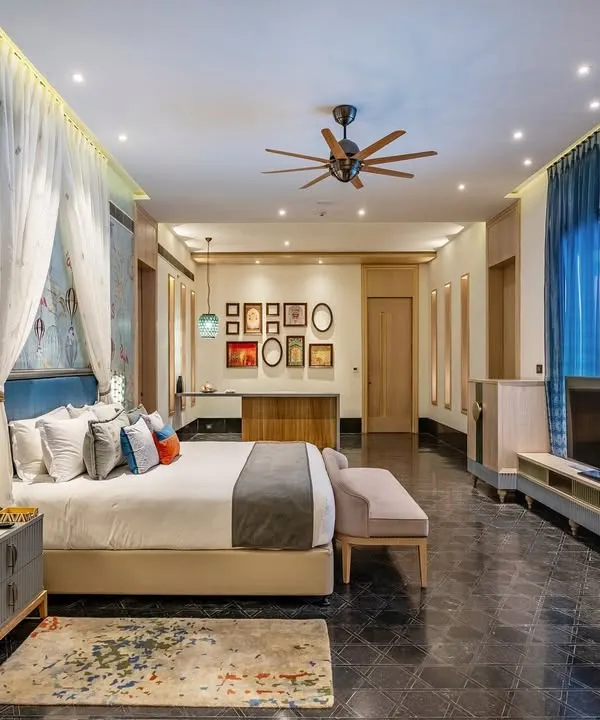 This suite at the Taj Devi Ratn, Jaipur, is a dreamscape we brought to life. The whimsical hot air balloon wallpaper, deep blue sheer curtains, and layered bespoke bedding come together to create a space that is both playful and profoundly luxurious.