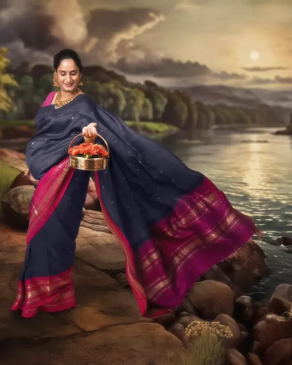 Echoes of elegance. Inspired by the legendary Raja Ravi Varma, this enchanting scene places our beautiful mumma-to-be serenely by a painted river.