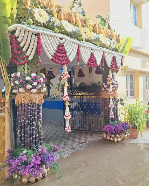 A complete view of a traditional house entrance decoration. I used sugarcane pillars, jasmine garlands, coconut leaf weaving, and even fresh pineapples to create a welcoming and auspicious entryway for the ceremony.