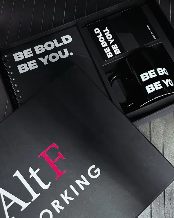 A closer look at the custom gift box we designed for Alt F Coworking. The sleek black box features their logo, and inside, a branded notebook and mug carry a simple, powerful message: 'Be Bold. Be You.'