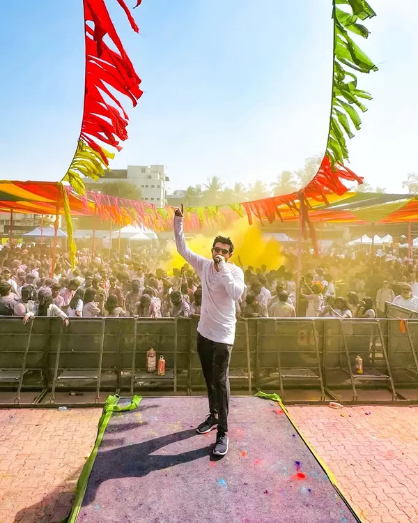 On stage at the Rang Leela Holi festival, getting the party started under the bright sun. The energy at these daytime events is amazing.