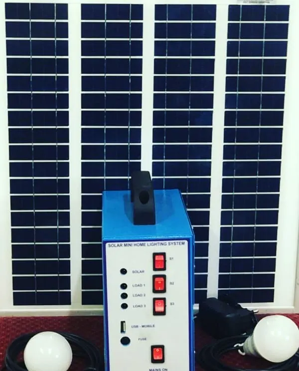 This is our complete Solar Mini Home Lighting System. The portable kit comes with a solar panel, a central power unit with a USB charging port, and two bright LED bulbs, making it a perfect plug-and-play power source for off-grid homes or emergencies.