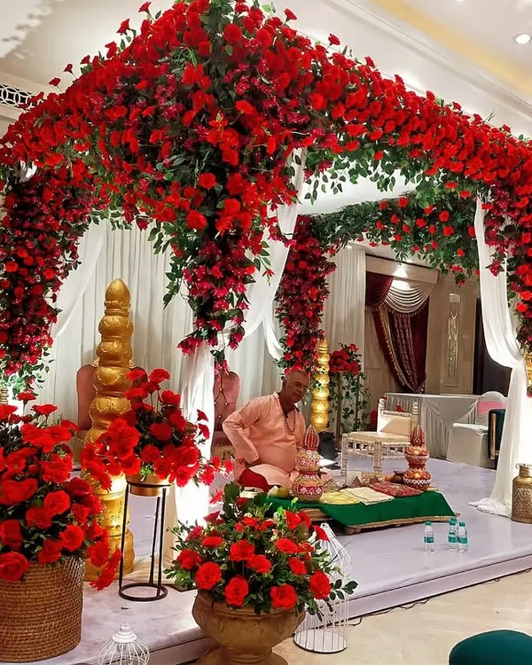 We were honored to create this breathtaking mandap, completely enveloped in a sea of vibrant red roses. This design focuses on creating a luxurious and sacred space for the wedding ceremony, ensuring an unforgettable experience.