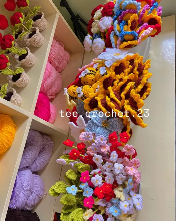 A beautiful mess of color! A collection of various flower stems and amigurumi overflowing from my shelves.