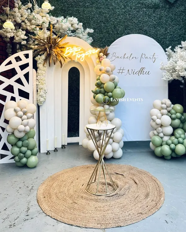 A "Better Together" bachelor party setup with a fresh green and white boho theme.